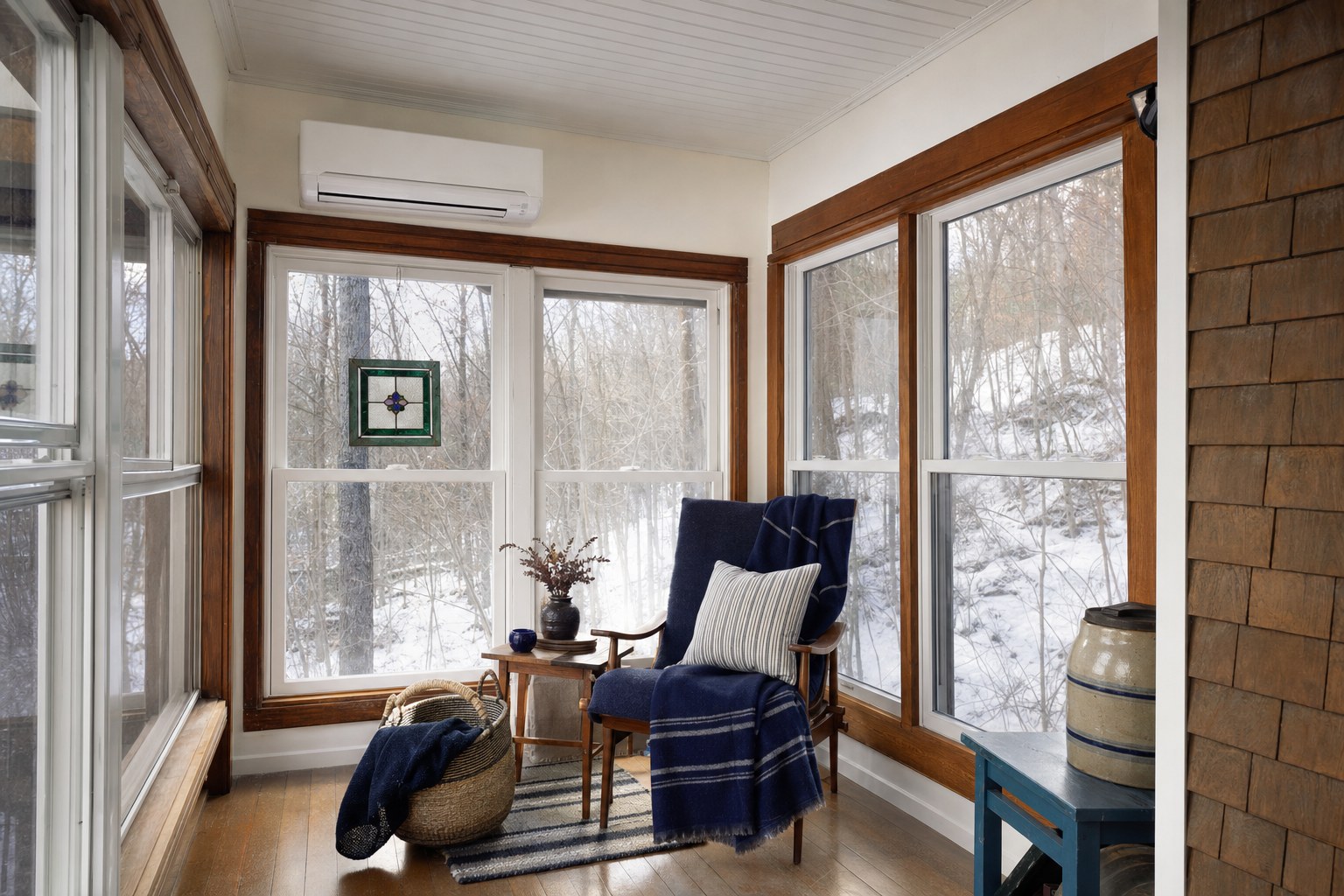 Maine sunroom with a wall-mounted ductless mini-split